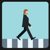 redhead pedestrian dressed in black suit 